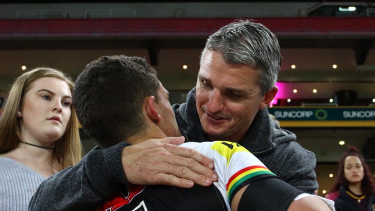 Together again? Ivan Cleary gives Nathan a hug after a Panthers game last season.