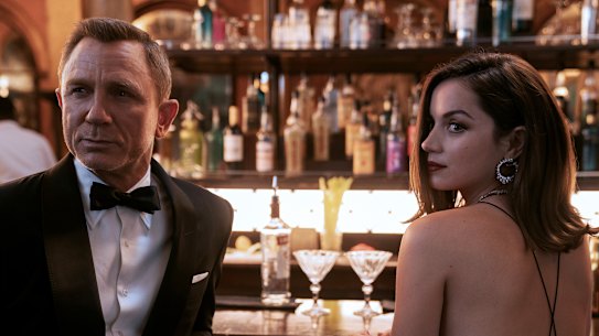 Daniel Craig with Ana de Armas in No Time to Die. 