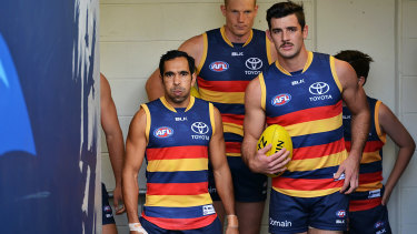 Eddie Betts and Taylor Walker walk out on to the field for a clash with the Saints in 2016.