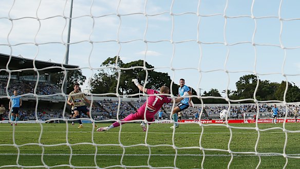 Luca Prso fires past Andrew Redmayne after the Sydney keeper gifted him an early opportunity.