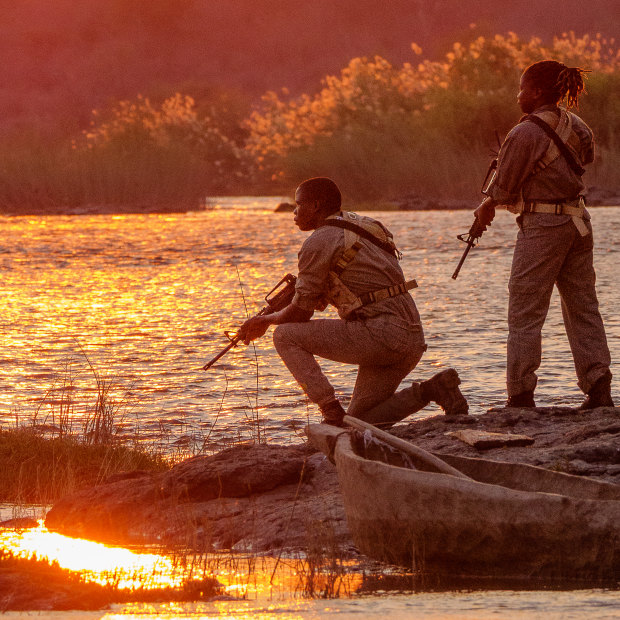 Members of the Amaganyane anti-poaching unit keep watch over the Zambezi River. 