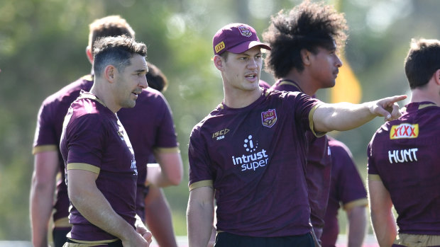 The master and the apprentice: Kalyn Ponga makes his thoughts known to Billy Slater.