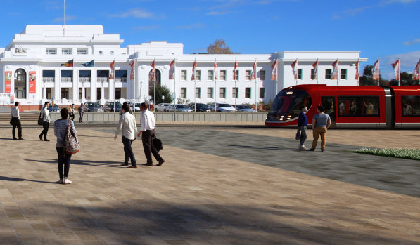 A light rail vehicle drives in front of Old Parliament House.