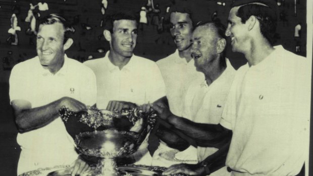 Australia’s victorious Davis Cup team is presented with the trophy in 1967. From left are: Tony Roche, John Newcombe, Bill Bowrey, Harry Hopman (manager) and Roy Emerson. 