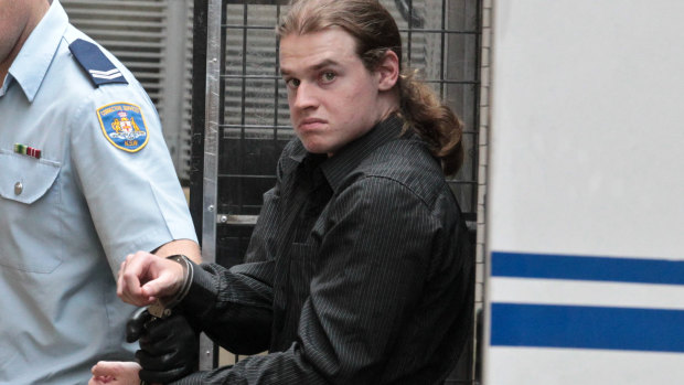 Daniel Chapman is led into the courts on Friday afternoon. 