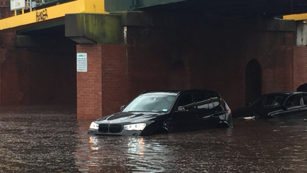 Two cars stuck under York Street Bridge in South Melbourne.