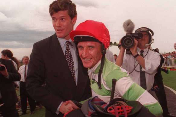 A young James Packer celebrates with jockey Greg Hall after his victory on Merlene in the 1996 Golden Slipper at Rosehill.