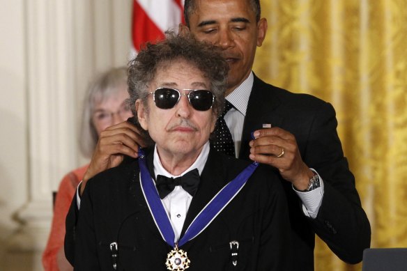 Former president Barack Obama presents Bob Dylan with a Medal of Freedom in 2016.
