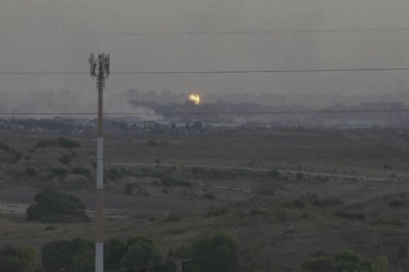 A screenshot of footage from southern Israel that shows flames and smoke rising from what Palestinian medics say is an Israeli airstrike in Gaza.