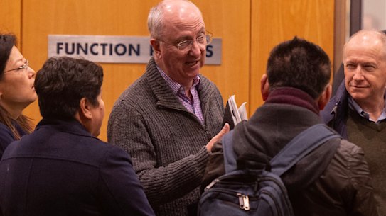 Mascot Towers owners arrive at Holiday Inn, ahead of their meeting with  strata and property managers.