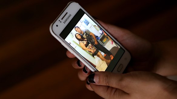 Iuliana Triscaru with her brother Beniamin Farcas in a photograph shown on her sister-in-law Lara's phone.