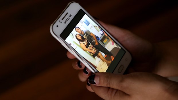 Iuliana Triscaru with her brother Beniamin Farcas in a photograph shown on her sister-in-law Lara's phone.