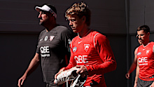 Dean Cox, Sydney Swans head coach and Callum Mills are seen before a Sydney Swans AFL training session