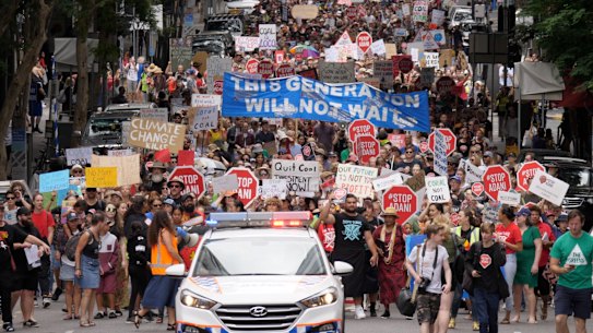 Students 'march for our future' in Brisbane to stop Adani