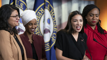 Alexandria Ocasio-Cortez speaks at a news conference with, from left, Rashida Tlaib, Ilhan Omar and Ayanna Pressley. "This is the agenda of white nationalists ... this is his plan to pit us against one another," said Ms Omar.