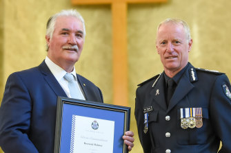 Lawyer Bernie Balmer, pictured with Deputy Commissioner Rick Nugent, after accepting the  commendation he received from Victoria Police for his actions during the Russell Street bombing in 1986. 