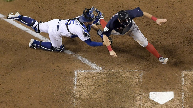 Dodgers catcher Austin Barnes tags Boston's Ian Kinsle.
