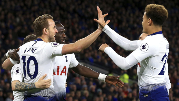 Second again: Harry Kane celebrates with teammates during their triumph against Cardiff City.