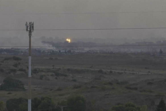 A screenshot of footage from southern Israel that shows flames and smoke rising from what Palestinian medics say is an Israeli airstrike in Gaza.