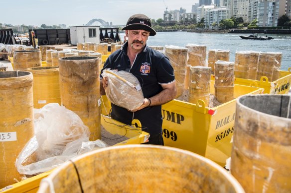 Fireworks are prepared by Foti Fireworks International on barges in White Bay in December 2018.