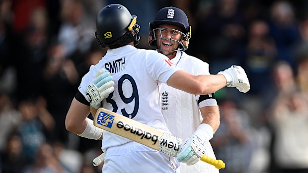 Joe Root and Jamie Smith embrace after England secure victory on day five of their Test against India.