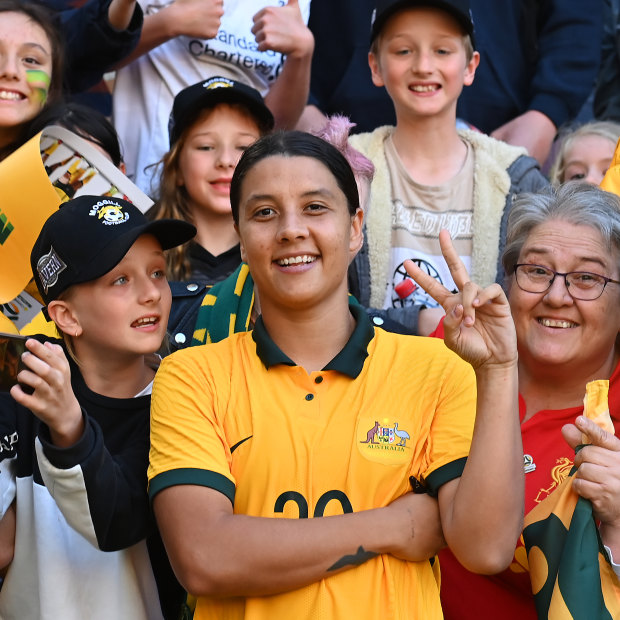 Sam Kerr poses with Matildas fans at a friendly against Canada in September 2022.