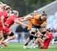 Australia’s Kaitlan Leaney takes it up to her Welsh opponents in the Test in Brisbane.
