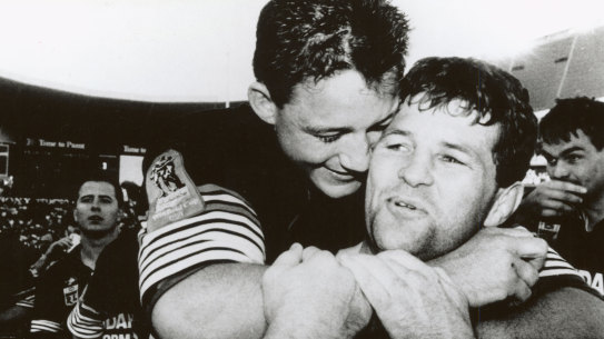 Royce Simmons celebrates the 1991 grand final win with Mark Geyer.