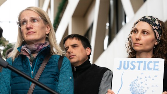 Sarah Kuhnen, in blue, and other "Justice for Justine" activists outside the Minneapolis courtroom this week.