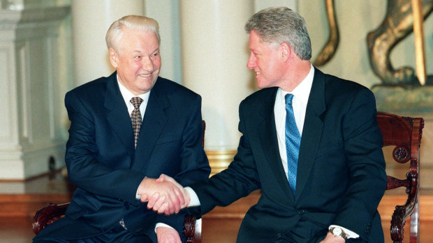 US President Bill Clinton, right, and his Russian counterpart Boris Yeltsin shake hands at the Helsinki Summit to discuss NATO expansion in 1997.