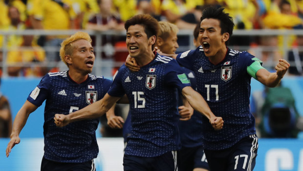 Japan's Yuya Osako celebrates scoring his side's second goal against Colombia. 