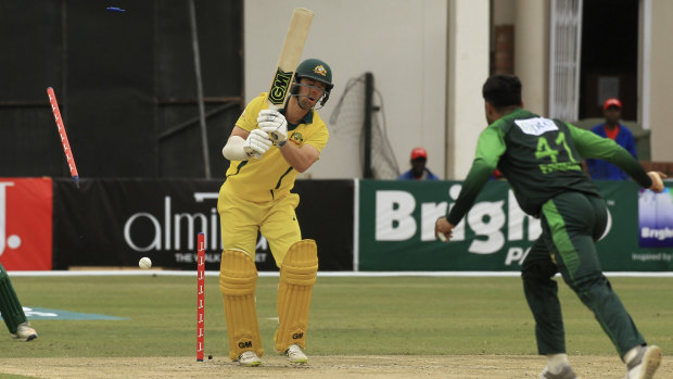 Skittled: Australia's Travis Head is clean bowled during their defeat by Pakistan.