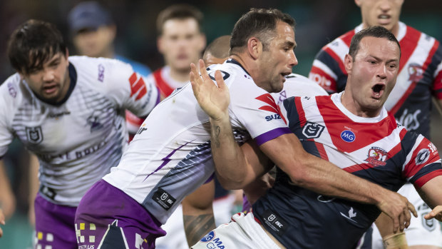 Better late than never: Cameron Smith tackles Boyd Cordner but ultimately came off second-best on the night.