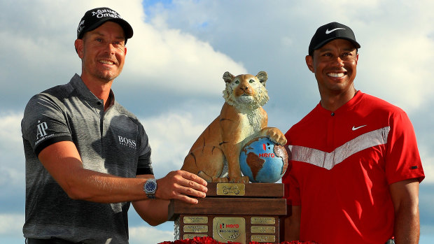 Tournament host Tiger Woods with Henrik Stenson after the Swede won the Hero World Challenge at Albany.