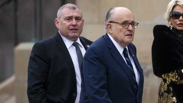 Rudy Giuliani, with Lev Parnas, arriving before a state funeral service for former US president George H.W. Bush in 2018.