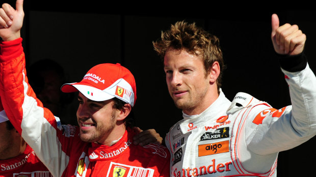 Ferrari's Fernando Alonso (left) with  McLaren Mercedes' Jenson Button in Italy during their Formula One heyday.
