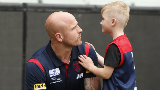 Nathan Jones, pictured with his young son Remy.