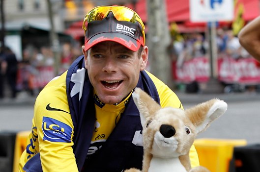 Cadel Evans cycles down the Champs Elysees in Paris after winning the Tour de France in 2011. 