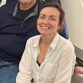 Alsu Kurmasheva aboard a plane home after being freed.