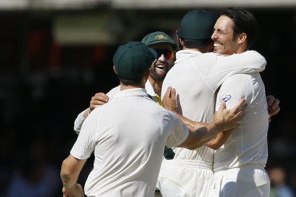 Mitchell Johnson (right) and the Aussies celebrate the dismissal of Moeen Ali.