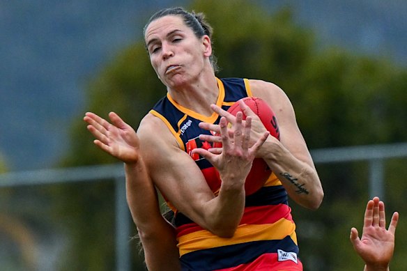 Adelaide AFLW veteran Chelsea Randall takes a strong grab on Sunday against Geelong.