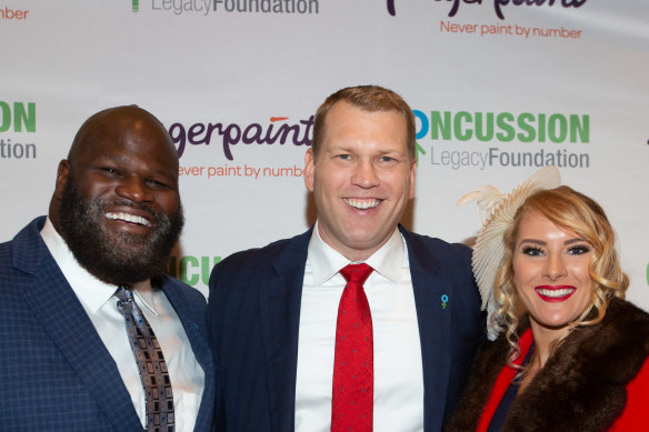 Chris Nowinski (centre) with WWE stars Mark Henry and Lacy Evans at the annual Concussion Legacy Gala in October.