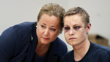 Philip Manshaus, right and his lawyer Unni Fries attend the court hearing.