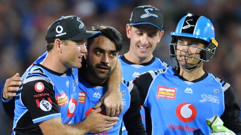 Right way to end the year: Strikers players celebrate the dismissal of Daniel Sams at Adelaide Oval.