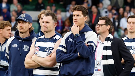 The disappointed Cats watch on at the medal presentation.