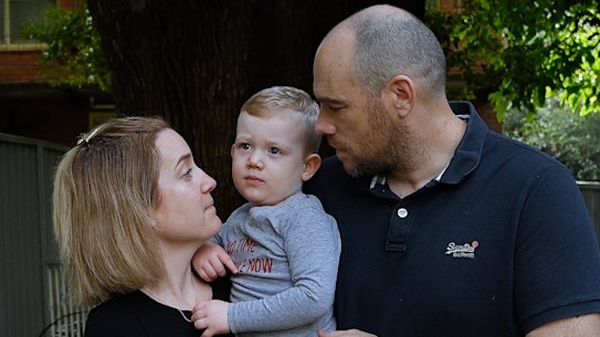 Alicia and Andy Jones, with their son Miles. Ms Jones caught COVID-19 twice, once as the Delta wave peaked and in March as Omicron swept through NSW.