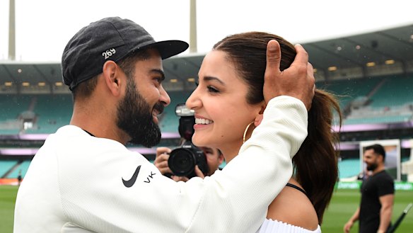 Indian captain Virat Kohli celebrates with his wife Anushka Sharma as they celebrate a 2-1 series victory over Australia following play being abandoned in the Fourth Test match between Australia and India at the SCG in Sydney, Monday, January 7.