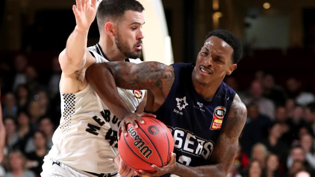 Adelaide's Deshon Taylor (right) takes on Melbourne United's Chris Goulding in an NBL pre-season match.