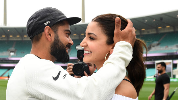 Indian captain Virat Kohli celebrates with his wife Anushka Sharma as they celebrate a 2-1 series victory over Australia following play being abandoned in the Fourth Test match between Australia and India at the SCG in Sydney, Monday, January 7.