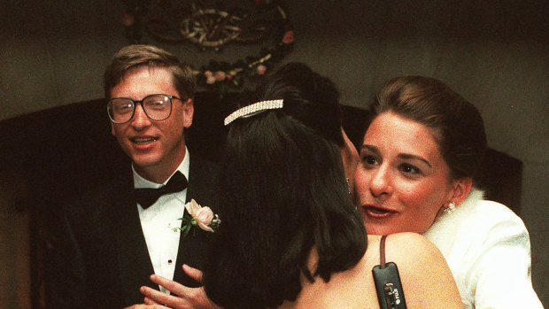 In 1994, as newlyweds, Bill Gates and Melinda French greet guests in a reception line at a private estate in Seattle. 